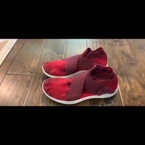 Red Nike Free tennis shoes.